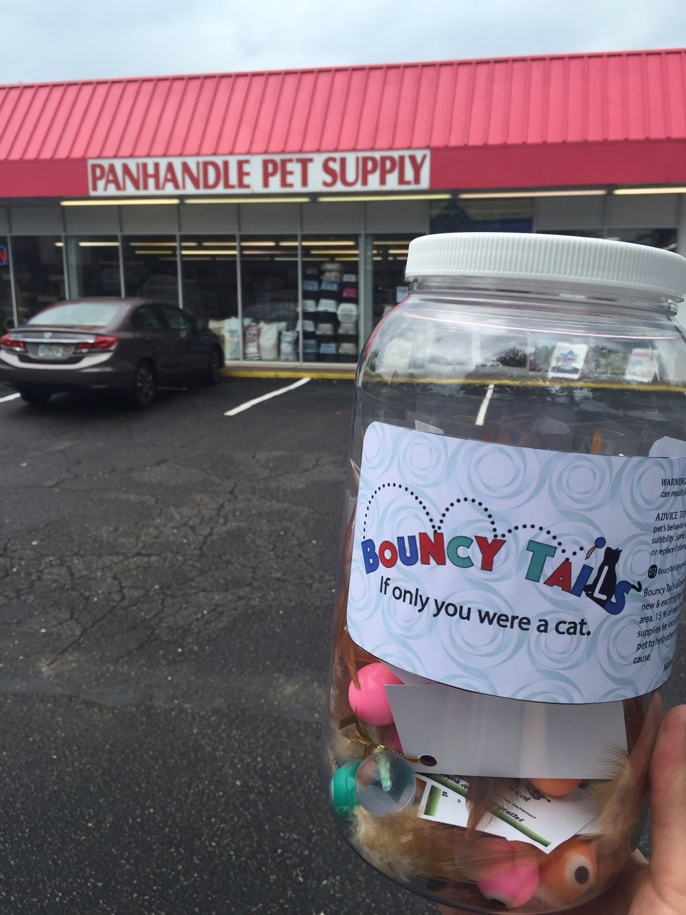 A jar of Bouncy Tails outside Panhandle Pet Supply